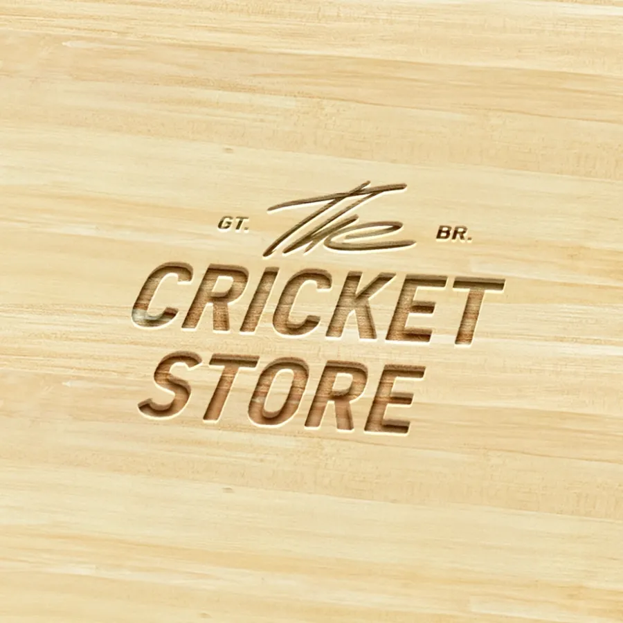 The Cricket Store logo engraved on willow wood, branding design by On Poynt Creative