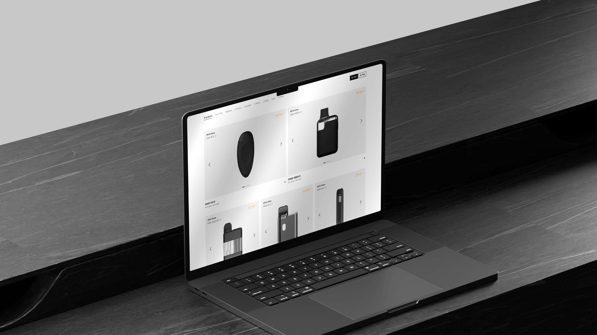 Ispire laptop mockup on wood desk showing product catalog grid page, website design by On Poynt Creative