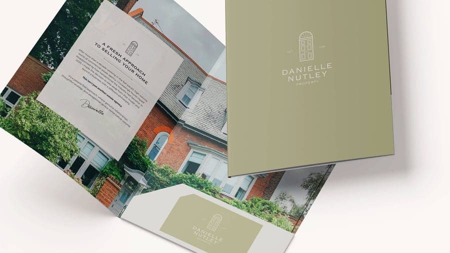 Danielle Nutley Properties brochure booklet and business card mockups with house door logo mark, brand and print design by On Poynt Creative